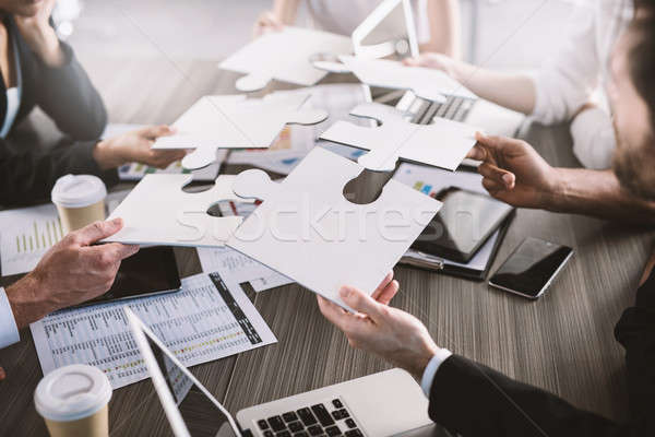 Teamwork of partners. Concept of integration and startup with puzzle pieces Stock photo © alphaspirit