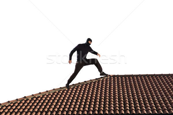 Tolvaj tető fekete sétál ház férfi Stock fotó © alphaspirit