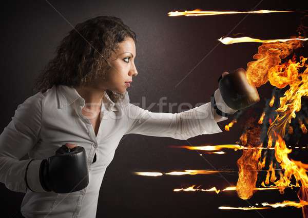 Businesswoman vs fire Stock photo © alphaspirit