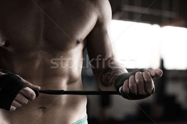 Boxer puts the tapes to his hands Stock photo © alphaspirit