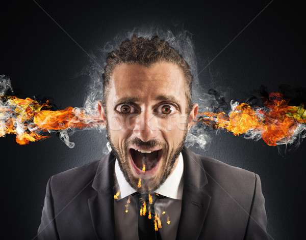 Stressed man spits fire Stock photo © alphaspirit