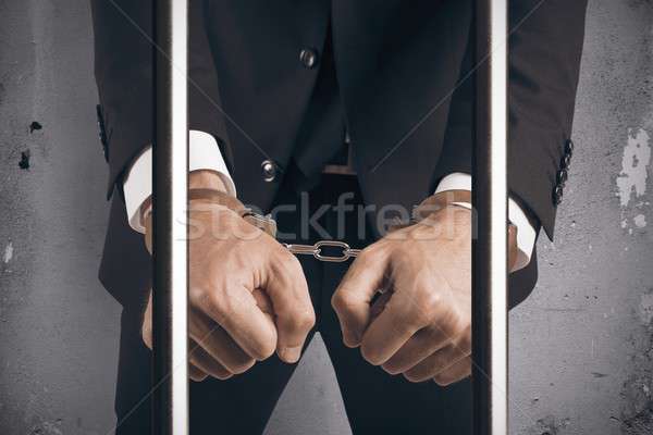 Businessman handcuffed Stock photo © alphaspirit