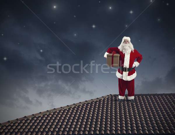 Santa Claus on a roof Stock photo © alphaspirit