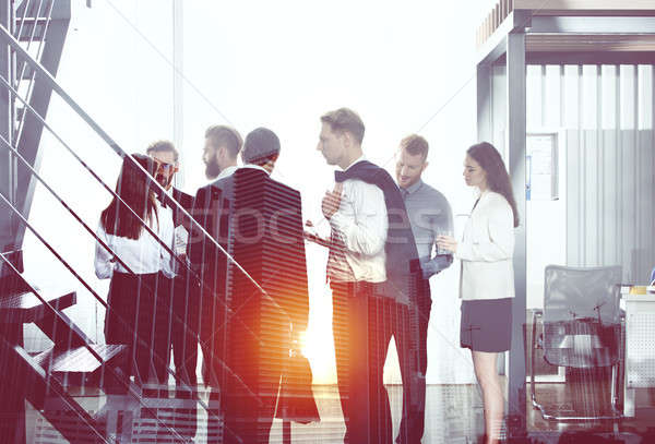 Businessmen that work together in office. Concept of teamwork and partnership. double exposure Stock photo © alphaspirit