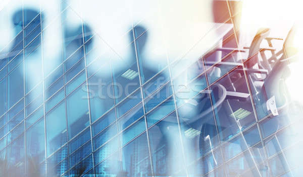 Stock photo: Businessmen that work together in office. Concept of teamwork and partnership. double exposure