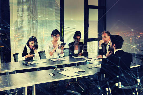 Businessperson in office with network effect. concept of partnership and teamwork Stock photo © alphaspirit