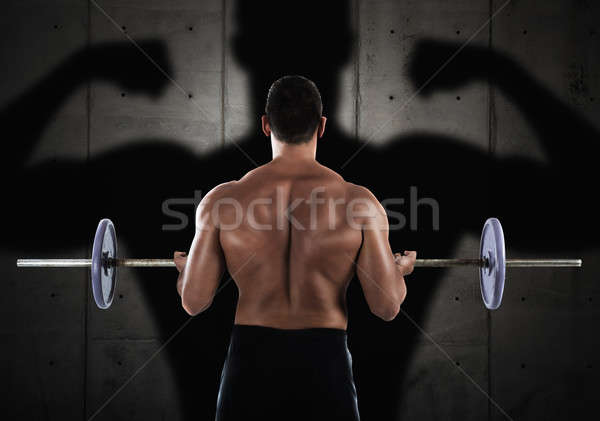 Workout with barbell Stock photo © alphaspirit