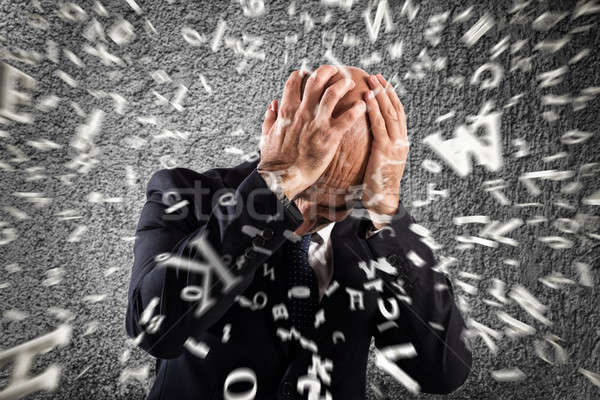 Stock photo: Businessman stunned by strong headache