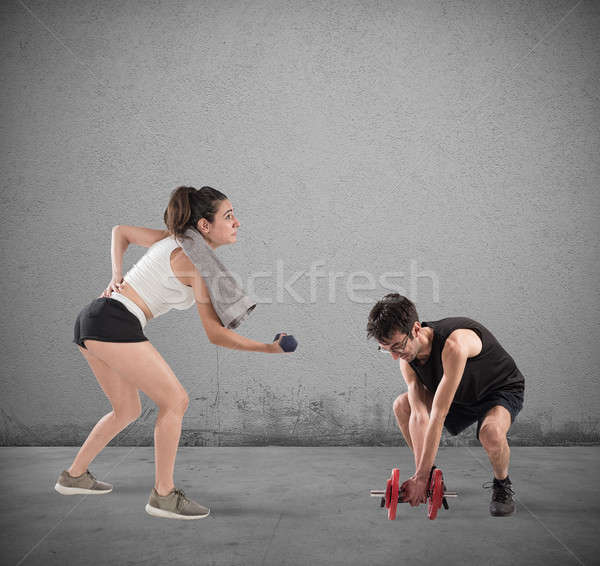 Fiú lány nehézség tornaterem fitnessz vonat Stock fotó © alphaspirit