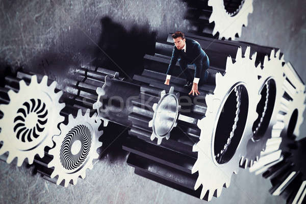 Man in a system of gear Stock photo © alphaspirit