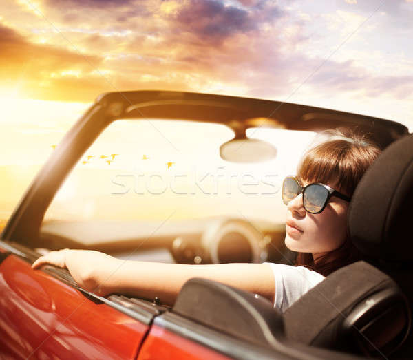 Young woman in cabriolet car near sea Stock photo © alphaspirit