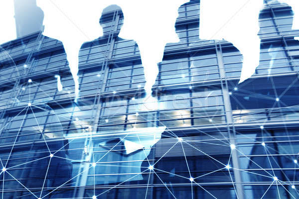 Businessmen that work together in office with network connection effect. Concept of teamwork and par Stock photo © alphaspirit