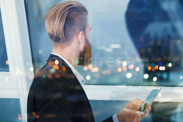 Businessman looks far for the future into the night. Concept of innovation and startup Stock photo © alphaspirit