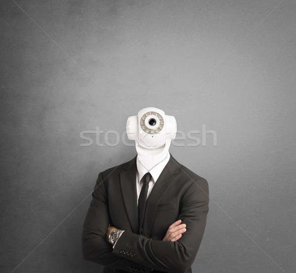 Businessman with security camera Stock photo © alphaspirit