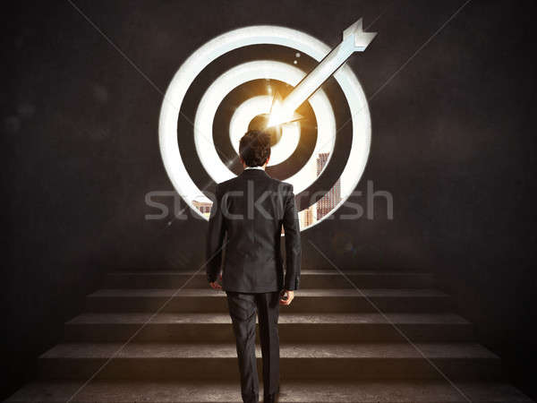 Arrive at a goal of success. Businessman climbing the stairs up to a target.. 3D Rendering Stock photo © alphaspirit