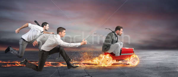 Fast businessman with a car wins against the competitors. Concept of success and competition Stock photo © alphaspirit