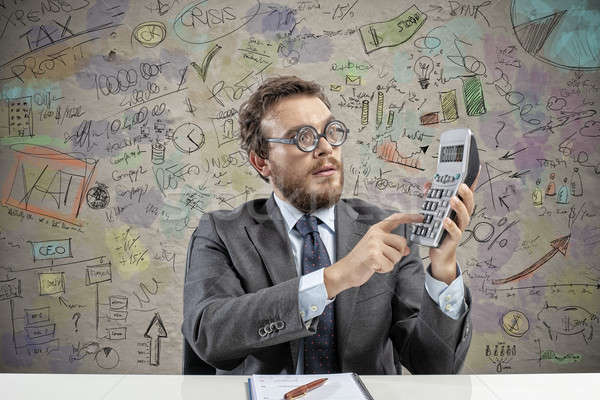 Nerd accountant does calculation of company revenue Stock photo © alphaspirit