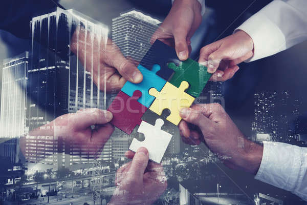 Teamwork of partners. Concept of integration and startup with puzzle pieces. double exposure Stock photo © alphaspirit