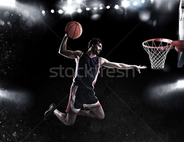 Basket player throws the ball at the stadium Stock photo © alphaspirit