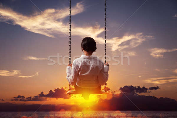 Freedom and carefree of a young female on a swing Stock photo © alphaspirit