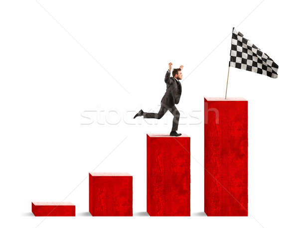 Businessman reaches glory on a statistical scale Stock photo © alphaspirit