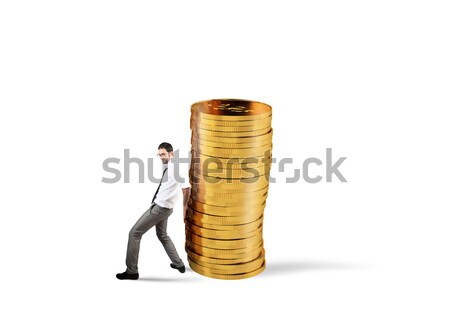 Businessman moves a pile of coins. concept of difficulty to saving money Stock photo © alphaspirit