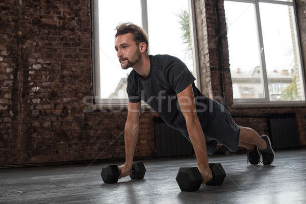 Man doing pushups at the gym Stock photo © alphaspirit