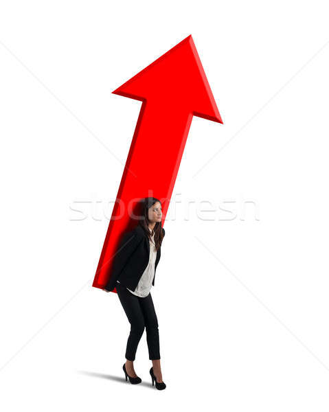 Businesswoman holds a big arrow. Concept of business growth and success Stock photo © alphaspirit