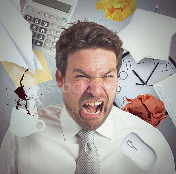 Businessman stressed and pissed from work overload Stock photo © alphaspirit