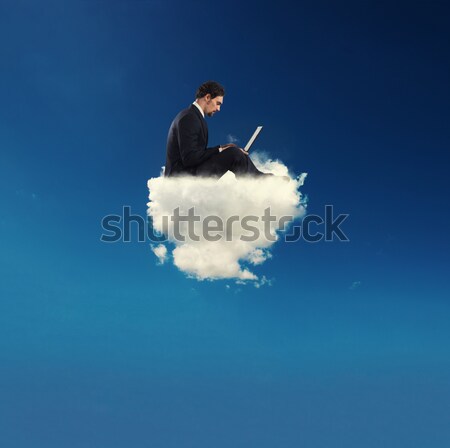 Stressed businessman relaxing on a soft cloud Stock photo © alphaspirit