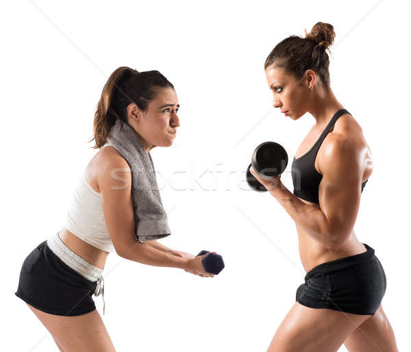 Training Fitnessstudio Ausbilder muskuläre Mädchen Züge Stock foto © alphaspirit