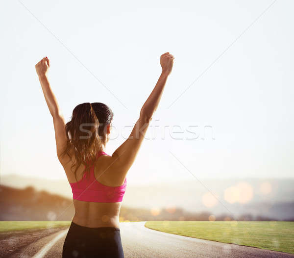 Girl exults in victory sign Stock photo © alphaspirit