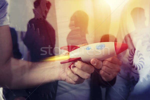 Businessman launches his startup company. double exposure with gears system Stock photo © alphaspirit