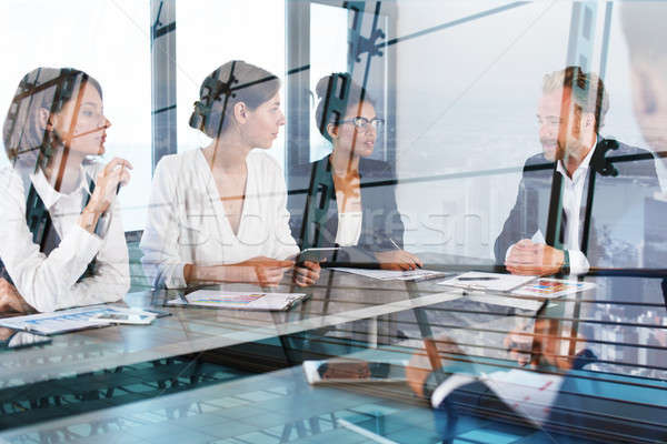 Team of businessmen work together in office. Concept of teamwork and partnership Stock photo © alphaspirit