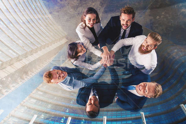 Business people putting their hands together. Concept of integration, teamwork and partnership. doub Stock photo © alphaspirit