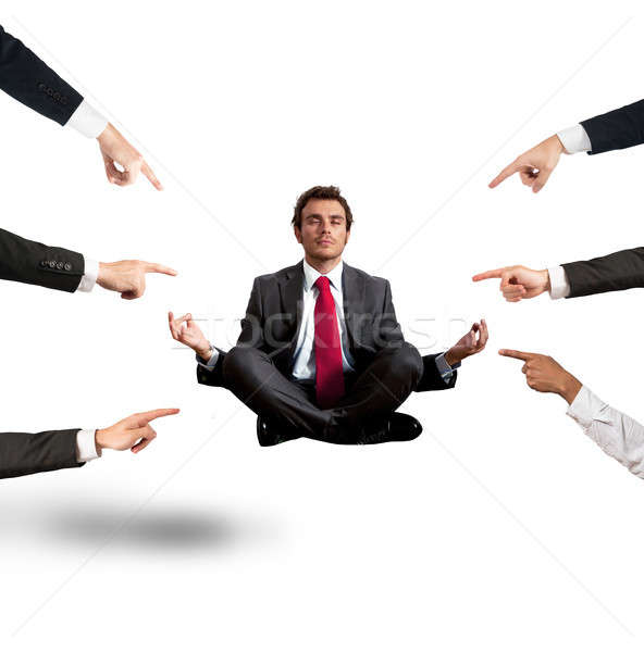 Relaxed businessman under the accusations of colleagues Stock photo © alphaspirit