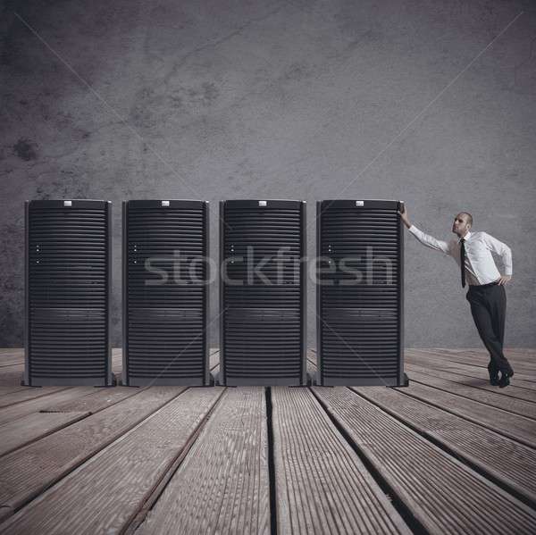 Businessman with server Stock photo © alphaspirit
