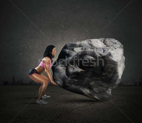 Power of muscular woman Stock photo © alphaspirit