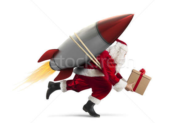Fast delivery of Christmas gifts ready to fly with a rocket isolated on white background Stock photo © alphaspirit