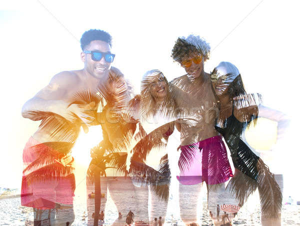 Group of happy friends having fun at ocean beach. double exposure Stock photo © alphaspirit