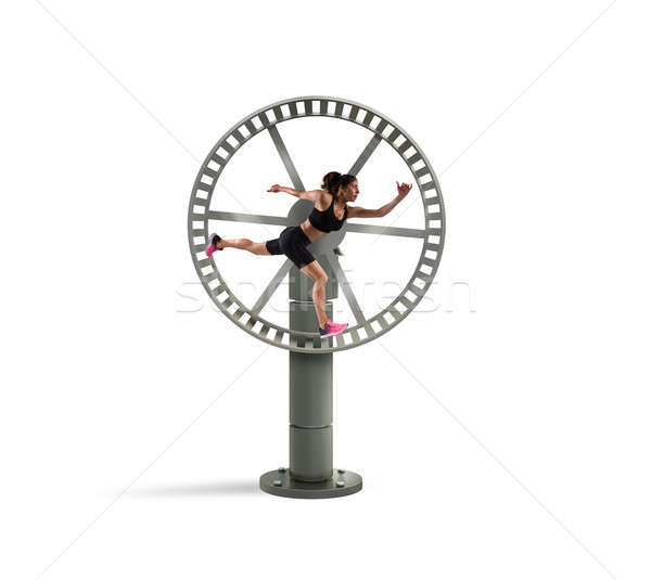Athletic woman runs in a looping wheel. concept of sport routine Stock photo © alphaspirit