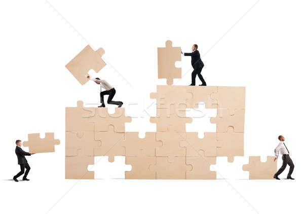 Stockfoto: Bouwen · business · team · zakenlieden · samenwerken · puzzel · man