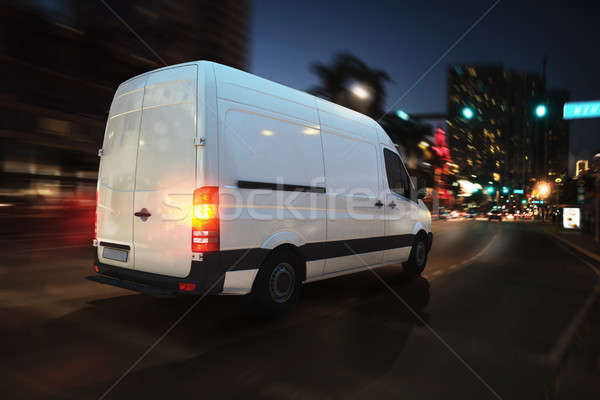 Fast van on a city road delivering at night. 3D Rendering Stock photo © alphaspirit