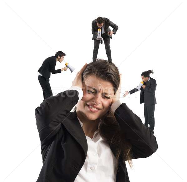 Businesswoman annoyed by screams Stock photo © alphaspirit