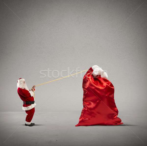Heavy bag of gifts Stock photo © alphaspirit