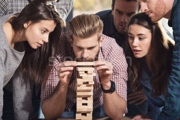 Team of business people build a wooden construction. concept of teamwork ,partnership and company st Stock photo © alphaspirit