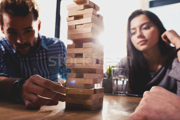 Team of business people build a wooden construction. concept of teamwork ,partnership and company st Stock photo © alphaspirit