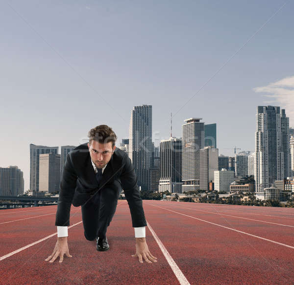 Businessman acts like a runner. Competition and challenge in business concept Stock photo © alphaspirit