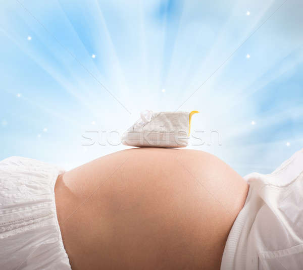 Bébé chaussures femme enceinte ventre lumière santé [[stock_photo]] © alphaspirit