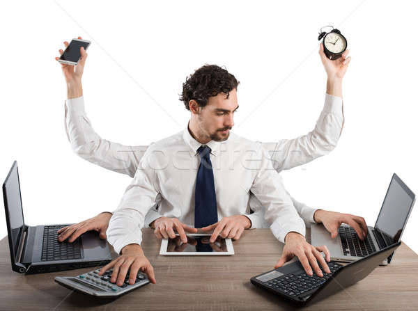 Businessman multitasking Stock photo © alphaspirit